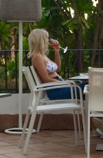 ASHLEY JAMES in Bikini Top at Her Hotel in Marbella 05/26/2017
