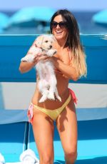 CLAUDIA ROMANI in Bikini with Her Dog Out in Miami 05/30/2017
