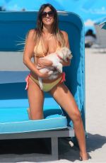 CLAUDIA ROMANI in Bikini with Her Dog Out in Miami 05/30/2017