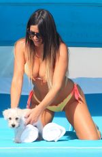 CLAUDIA ROMANI in Bikini with Her Dog Out in Miami 05/30/2017