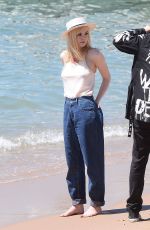 ELLE FANNING on the Set of a Photoshooting on the Beach in Cannes 05/20/2017