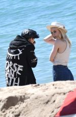 ELLE FANNING on the Set of a Photoshooting on the Beach in Cannes 05/20/2017