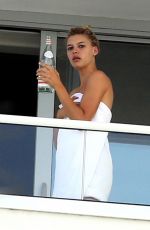 KELLY ROHRBACH on the Balcony of Her Hotel Room in Miami 05/12/2017