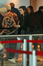 LILY COLLINS in Jeans at JFK Airport in New York 05/03/2017