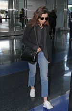 LILY COLLINS in Jeans at JFK Airport in New York 05/03/2017