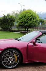 MICHELLE HUNZIKER Drives Her Porsche Out in Biella 05/06/2017