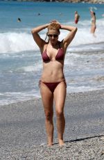 MICHELLE HUNZIKER in Bikini on the Beach in Varigotti 05/21/2017