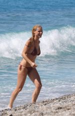 MICHELLE HUNZIKER in Bikini on the Beach in Varigotti 05/21/2017