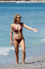 MICHELLE HUNZIKER in Bikini on the Beach in Varigotti 05/21/2017