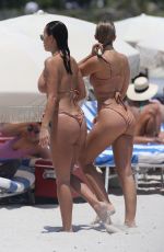 NATASHA OAKLEY and DEVIN BRUGMAN in Bikinis at a Beach in Miami 05/04/2017
