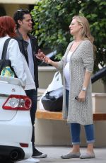 Pregnant ABI TITMUSS and Ari Welkom Share a Kiss Out in Los Angeles 05/28/2017
