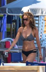 BROOKE BURKE in Bikini at a Beach in St Tropez 06/17/2017