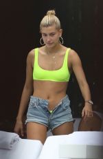 HAILEY BALDWIN in Bikini Top and Denim Shorts at a Pool in Miami 06/09/2017