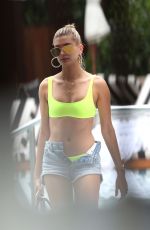 HAILEY BALDWIN in Bikini Top and Denim Shorts at a Pool in Miami 06/09/2017