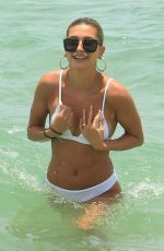 HAILEY BALDWIN in White Bikini on the Beach in Miami 06/12/2017