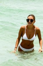 HAILEY BALDWIN in White Bikini on the Beach in Miami 06/12/2017