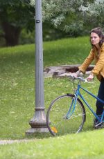 KATIE HOLMES Riding a Bike on the Set of The Gift in Montreal 06/22/2017