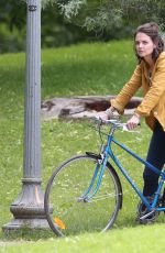 KATIE HOLMES Riding a Bike on the Set of The Gift in Montreal 06/22/2017