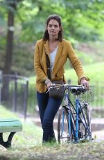 KATIE HOLMES Riding a Bike on the Set of The Gift in Montreal 06/22/2017