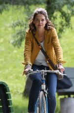 KATIE HOLMES Riding a Bike on the Set of The Gift in Montreal 06/22/2017