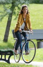 KATIE HOLMES Riding a Bike on the Set of The Gift in Montreal 06/22/2017