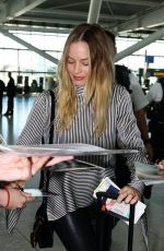 MARGOT ROBBIE Arrives at Heathrow Airport in London 06/01/2017