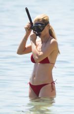 MICHELLE HUNZIKER in Bikini at a Beach in Varigotti 06/10/2017