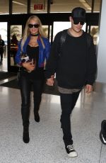 PARIS HILTON and Chris Zylka at LAX Airport in Los Angeles 06/08/2017