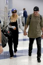 PARIS HILTON and Chris Zylka at LAX Airport in Los Angeles 06/11/2017