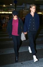 VANESSA HUDGENS and Austin Butler at LAX Airport in Los Angeles 06/26/2017