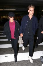 VANESSA HUDGENS and Austin Butler at LAX Airport in Los Angeles 06/26/2017