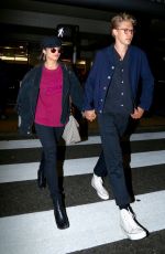 VANESSA HUDGENS and Austin Butler at LAX Airport in Los Angeles 06/26/2017