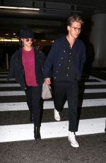 VANESSA HUDGENS and Austin Butler at LAX Airport in Los Angeles 06/26/2017