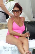 AMY CHILDS in Swimsuit at a Pool in Ibiza 07/19/2017