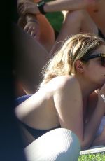 ASHLEY BENSON in Bikini at a Pool in Miami 07/03/2017
