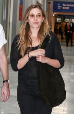 ELIZABETH OLSEN Arrives in Paris 07/02/2017