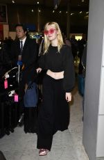 ELLE FANNING at Charles De Gaulle Airport in Paris 07/01/2017