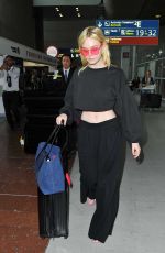 ELLE FANNING at Charles De Gaulle Airport in Paris 07/01/2017