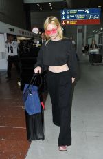 ELLE FANNING at Charles De Gaulle Airport in Paris 07/01/2017
