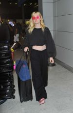 ELLE FANNING at Charles De Gaulle Airport in Paris 07/01/2017