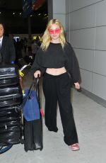 ELLE FANNING at Charles De Gaulle Airport in Paris 07/01/2017