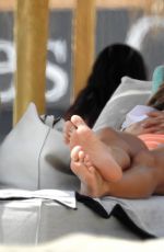 EVA LONGORIA in Swimsuit on Sunbed at a Beach in Marbella 07/13/2017
