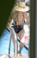 MICHELLE HUNZIKER in Swimsuit at a Pool in Milano Marittima 07/08/2017