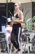 MILEY CYRUS in Bikini Top Out in Malibu 07/25/2017
