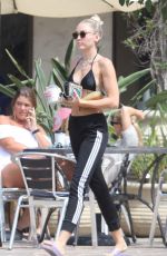 MILEY CYRUS in Bikini Top Out in Malibu 07/25/2017