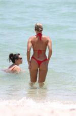NATASHA OAKLEY and DEVIN BRUGMAN in Bikinis at a Beach in Miami 07/18/2017