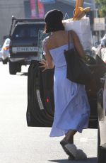 VANESSA HUDGENS Hides Behind a Bag of Baguettes in Studio City 07/03/2017
