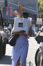 VANESSA HUDGENS Hides Behind a Bag of Baguettes in Studio City 07/03/2017