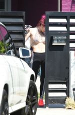 BELLA THORNE in Bikini Top Picks Up Her Delivery from Juice Crafters 08/05/2017