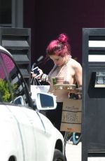 BELLA THORNE in Bikini Top Picks Up Her Delivery from Juice Crafters 08/05/2017